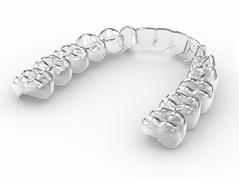 3d render of invisalign removable and invisible retainer over light background